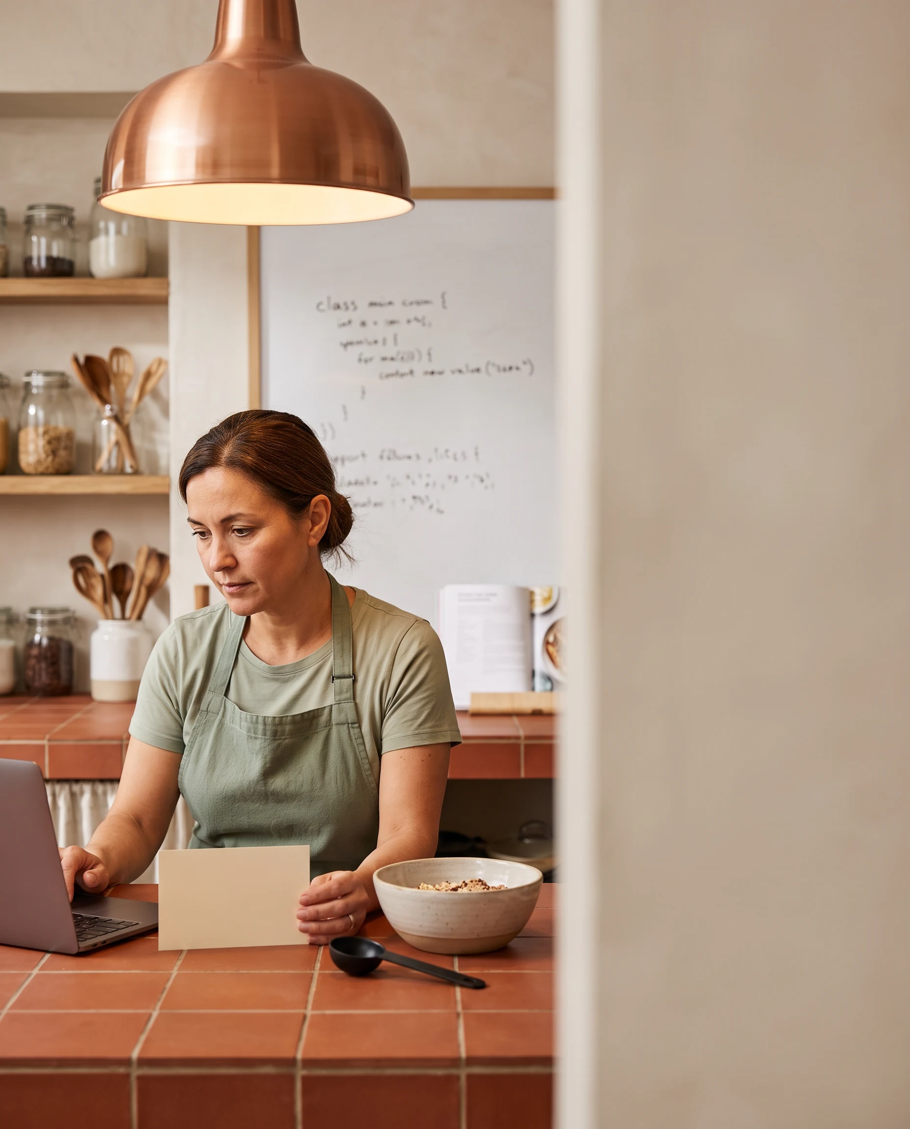 Person working at a warm kitchen counter